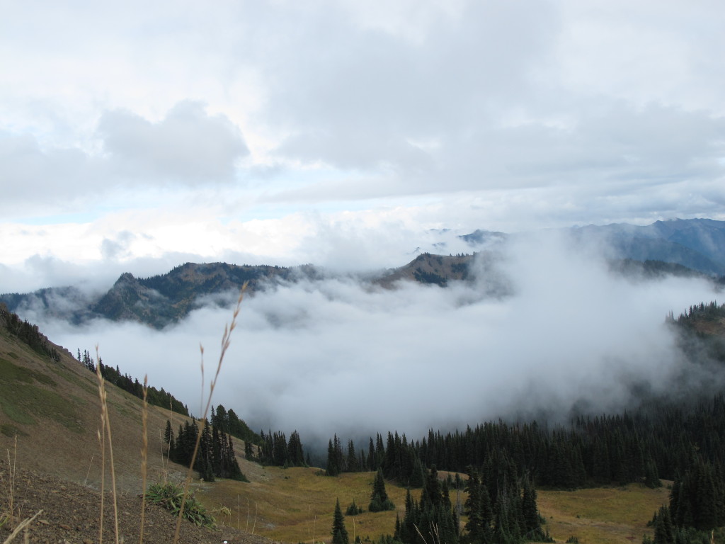 Clouds moving through mountain valleys.